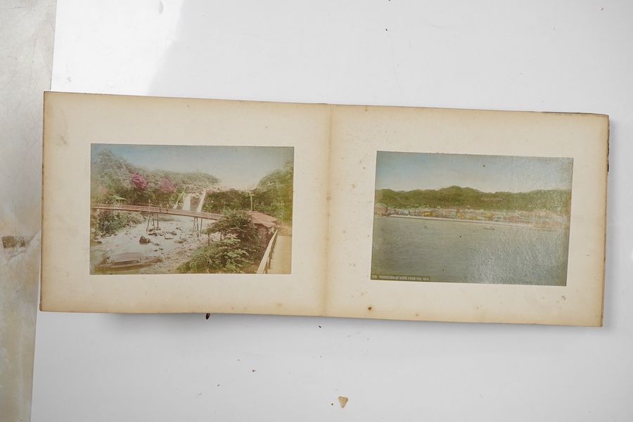 An early 20th century Japanese bone inlaid lacquer photograph album containing coloured photographs of people and Japanese scenes.19.5cm wide x 15.5cm high
